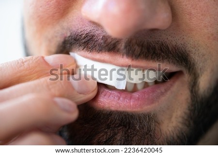Man Chewing Wet Moist Nicotine Tobacco Snus Product