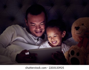 Man, Child And Digital Tablet Streaming Movies, Cartoon Or Game In Bed At Night. Happy Father And Son Browsing The Internet, Online Or Web With Social Media App While Watching A Comedy In The Bedroom