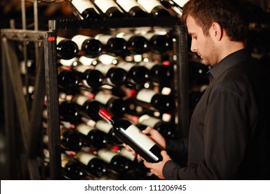Man chooses a bottle of wine