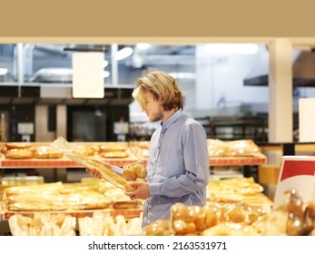 Man choosing bread from a supermarket	 - Powered by Shutterstock