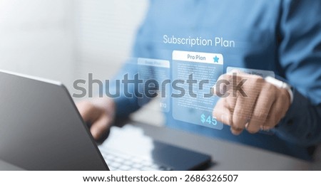 Man choosing digital subscription plan on virtual screen, representing online services, recurring billing, membership management, and pricing options for digital platforms and SaaS products.
