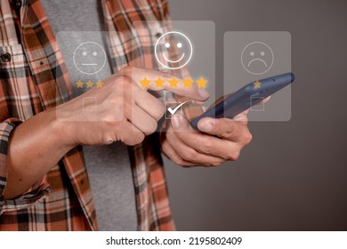 Man Choosing Happy Icon On Virtual Touch Screen At Smartphone, Satisfaction Survey. Mental Health Assessment. World Mental Health Day Concept