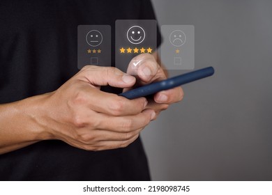 Man Choosing Happy Icon On Virtual Touch Screen At Smartphone, Satisfaction Survey. Mental Health Assessment. World Mental Health Day Concept.