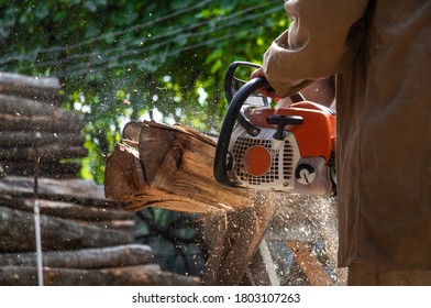 A Man Chopping Fire Wood For Winter