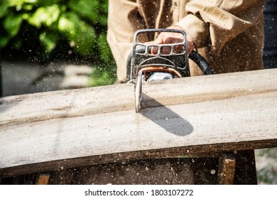 A Man Chopping Fire Wood For Winter