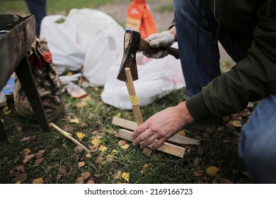 Man Chopping Firewood With An Ax