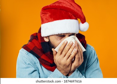 Man In Christmas Hat With Napkin In Hand Runny Nose Health Problems