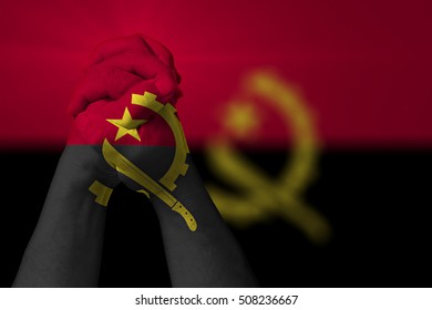 Man Clasped Hands Patterned With The ANGOLA Flag