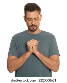 Man with clasped hands praying on white background