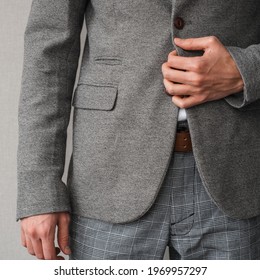 A Man In A Classic Gray Blazer And A White Shirt Unbuttons A Button On His Jacket Close Up. Mockup