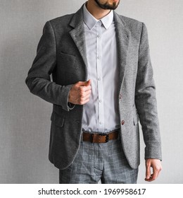 A Man In A Classic Gray Jacket And White Shirt On A Light Background. Businessman In A Suit. Mockup