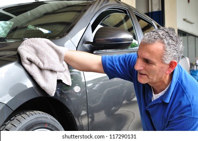 Man Cleaning A Car.