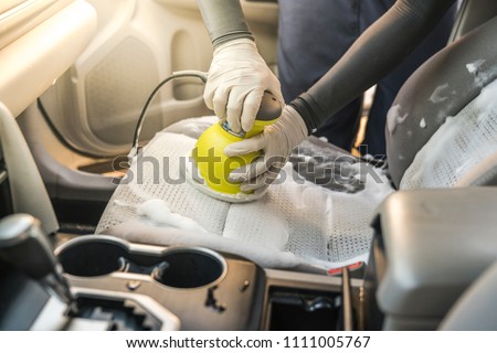 Man Cleaning Car Interior By Use Royalty Free Stock Image