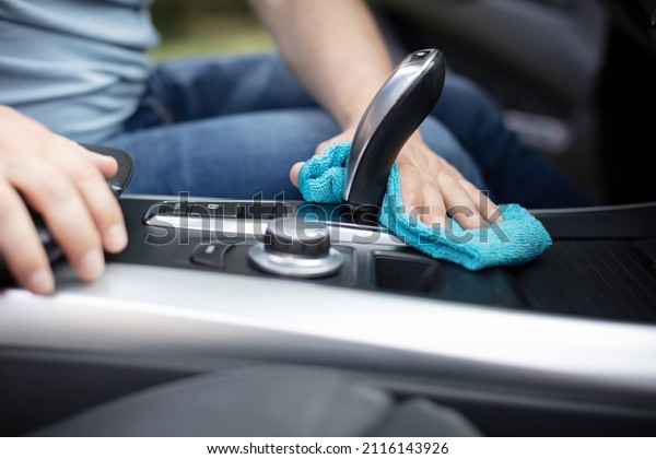 a man cleaning car interior car detailing concept
selective focus