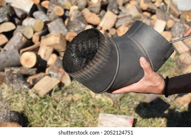 Man Cleaning Chimney Pipe Outside. Cleaning A Wood Burning Stove. Chimney Sweep Cleaning