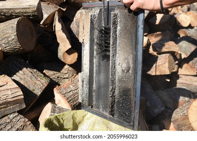 Man Cleaning Chimney Pipe Outside. Cleaning A Wood Burning Stove. Chimney Sweep Cleaning