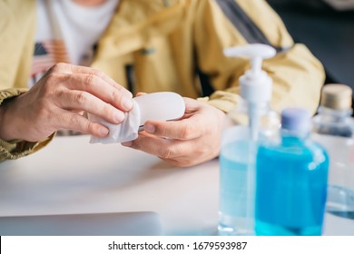 Man Cleaning Computer Mouse With Alcohol Pad Or Alcohol Based Wet Wipes.Hygiene Concept. Prevent The Spread Of Germs And Bacteria And Avoid Infections Corona Virus Or Covid19