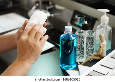 Man Cleaning A Computer Mouse With Alcohol Pad. Hygiene Sanitize Concept. Prevent The Spread Of Germs And Bacteria And Avoid Infections Corona Virus Or Covid 19.selective Focus   