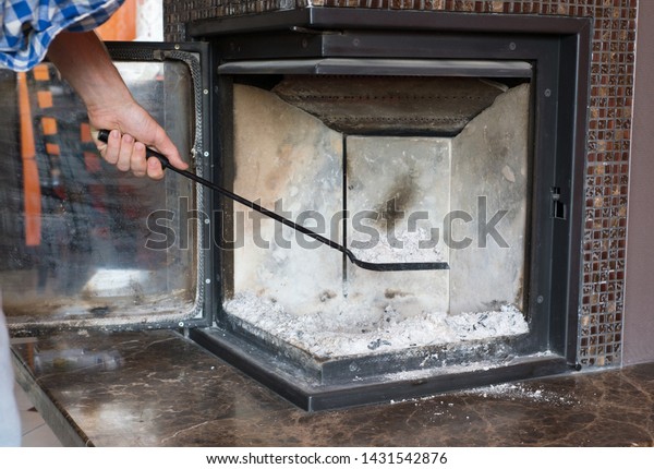 Man Cleaning Fireplace Ashes Royalty Free Stock Image