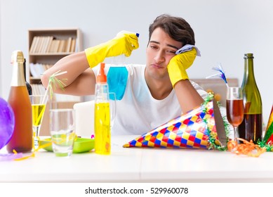 Man Cleaning The House After Christmas Party
