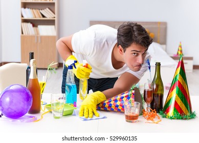 Man Cleaning The House After Christmas Party