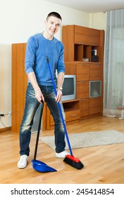  Man  Cleaning  In Living Room At Home