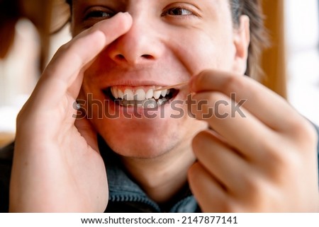 Similar – Crop unrecognizable teenage girl eating healthy walnut kernel