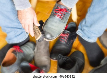 A Man Cleans The Shoes With A Brush, Bootblack