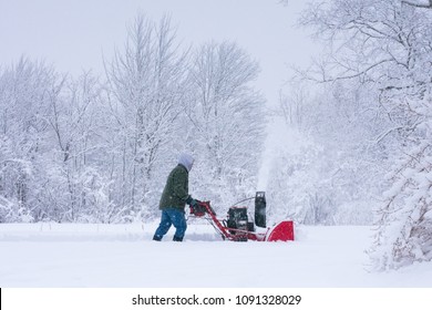 Man Clearing Snow With Snowblower