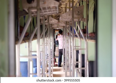 Man clearing things on train
