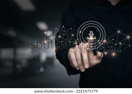 A man clicks on a virtual computer screen on the download button on a black background.
