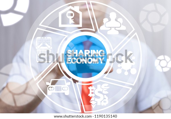 Man clicks a sharing\
economy text button on a virtual display. Sharing Economy Business\
Financial concept.