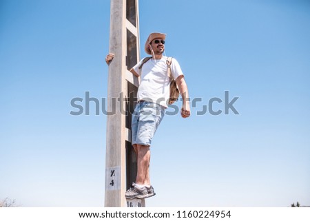 Similar – Image, Stock Photo man climbed a metal tower