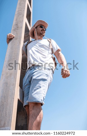 Image, Stock Photo man climbed a metal tower