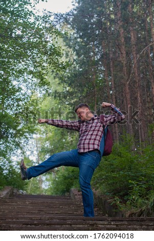 Similar – Woman walking on a fallen tree trunk