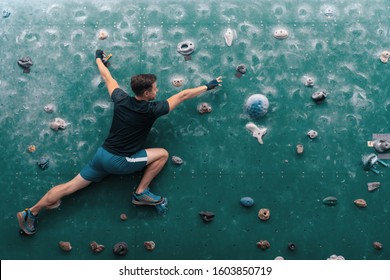 Man climbing bouldering problem. Rock-climbing. Climbing icon. Man climbing on wall. Climbing background. - Powered by Shutterstock