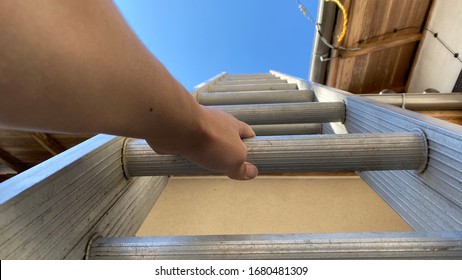 Man Climbing The Ladder In Construction Site - Repair Roof Because Storm Damage In Japan