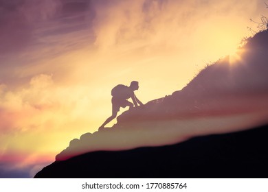 Man climbing up a mountain. Motivation, and inspiration concept.  - Shutterstock ID 1770885764