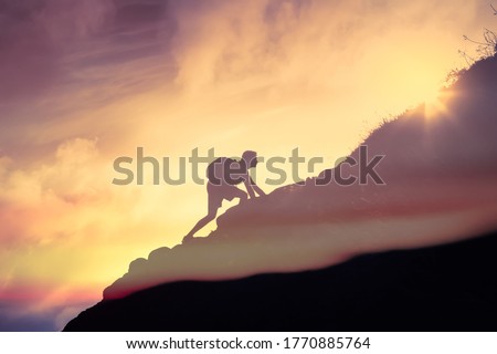 Man climbing up a mountain. Motivation, and inspiration concept. 