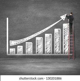 Man Climbing On Ladder Drawing Business Chart