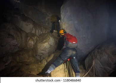 A Man Climbing Rock By Rope In Son Doong Cave, The Largest Cave In The World, Is In The Heart Of The Phong Nha Ke Bang National Park In The Quang Binh Province Of Central Vietnam