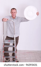 Man climbing step-ladder