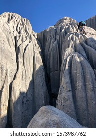 Man Climbing Through Dangerous, Deadly And Sharp Lapy Cliffs