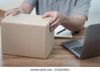 A Man Close And Check Parcel Box After Packing The Product To Be Transported To Customers By A Transport Company, Shopping Online Concept