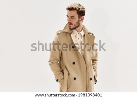 Similar – Image, Stock Photo Man in a coat standing on a sandy beach looking at a dog in the distance, with dunes and a blue sky overhead in Lariño, Galicia