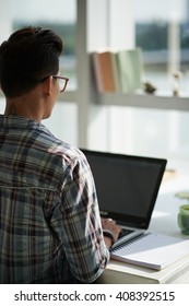 Man Coding On His Laptop, View Over The Shoulder