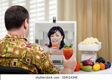 Man In Colored Shirt Has Just Learned How To Make A Detox Drinks To Flush Out Toxins At Home During On-line Lesson With Nutrition Coach