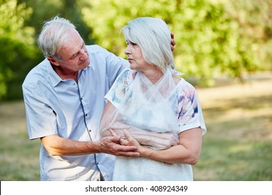 Man Comforting Old Woman With Broken Arm In A Loop