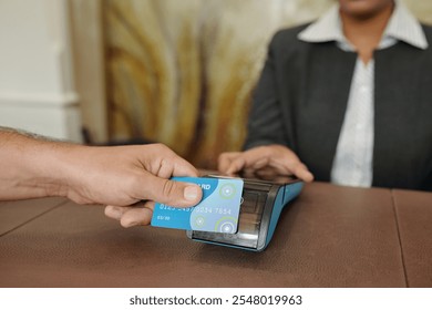 Man Completing Payment Using Card Reader Device - Powered by Shutterstock