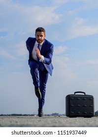 Man Concentrated Focused On Business Achievement. Business As Marathon Or Sprint. Entrepreneur Run To Stay Modern. Towards Success. Businessman Formal Suit Run Outdoors Blue Sky Background.